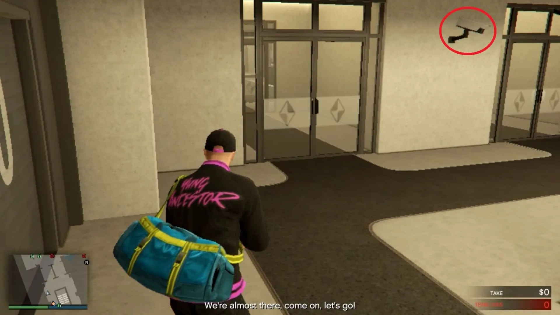 The security camera right beside the double doors leading to the security lobby area