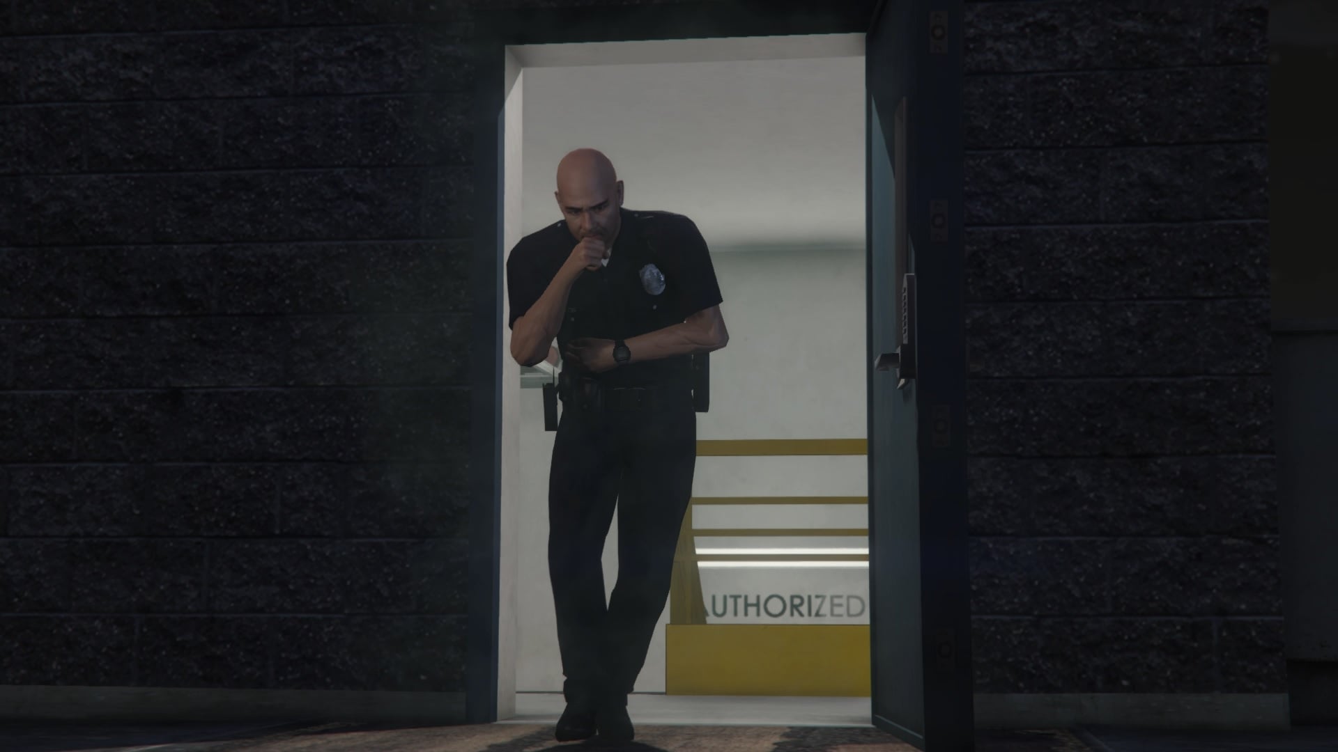 Cop coming out of the police station.