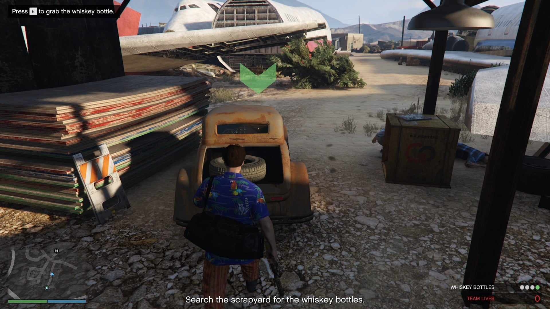 The whiskey bottle is in the back of the car.