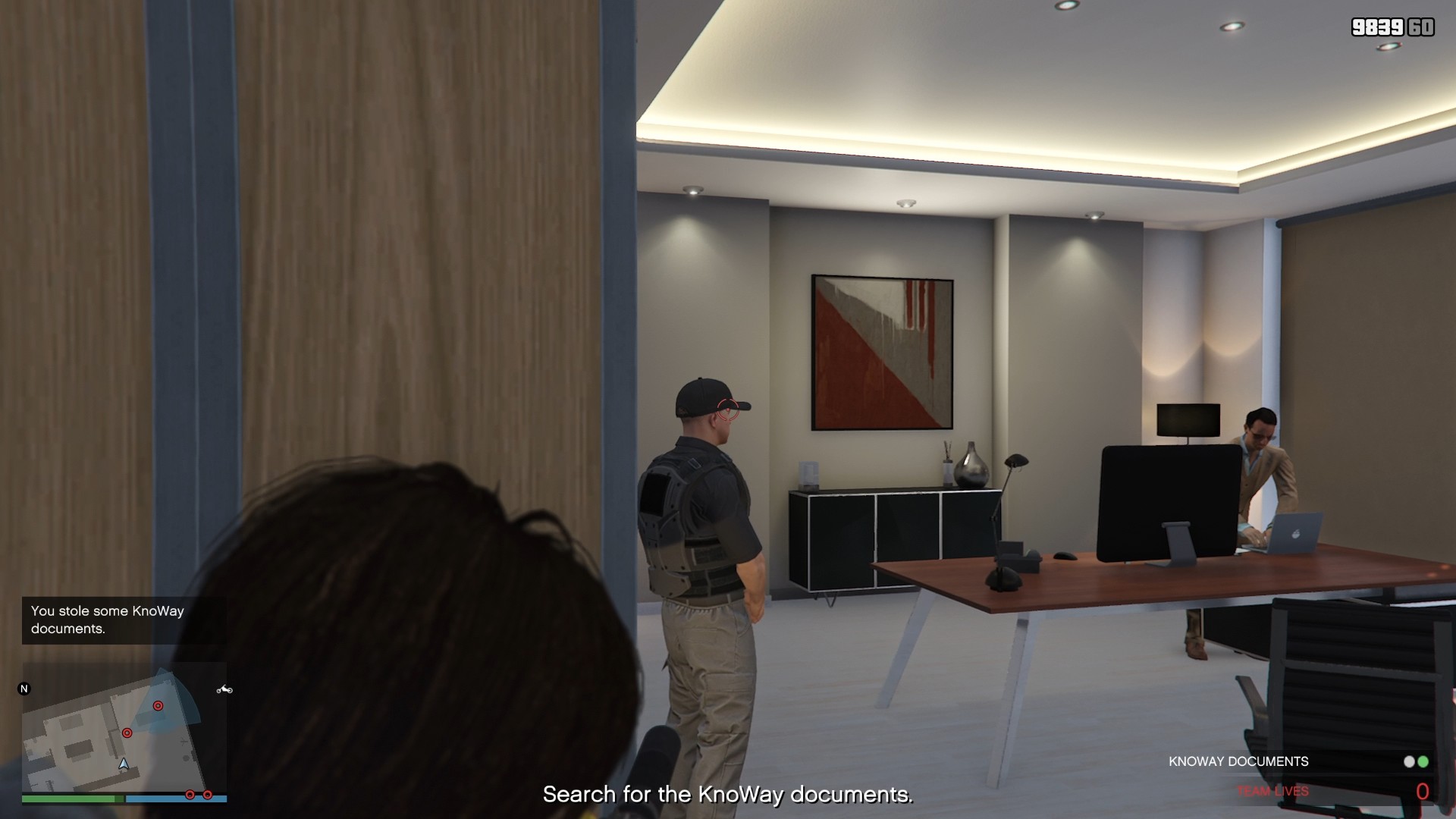 The guard and the employee, through the second server room door.