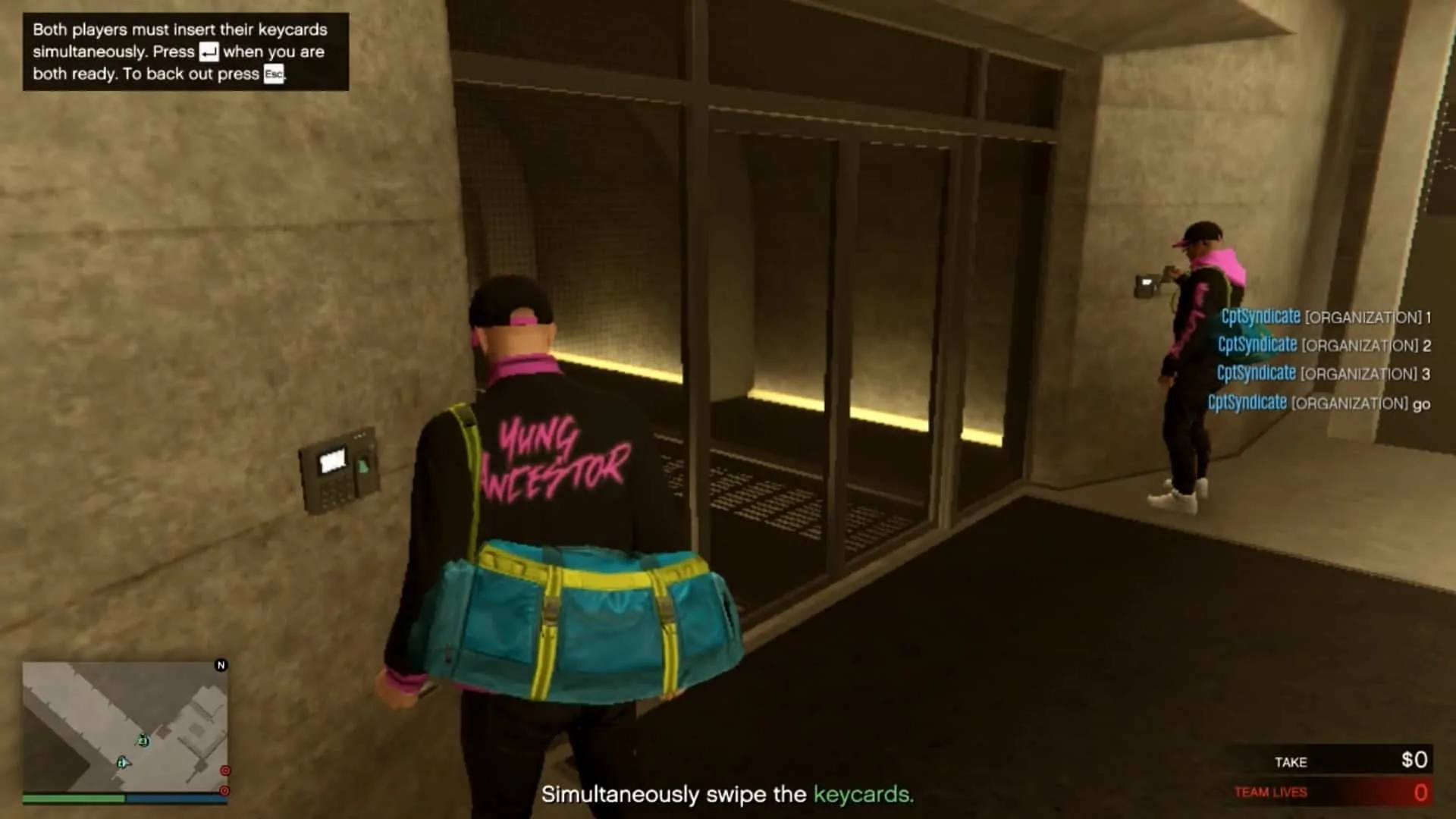 Swiping the keycard simultaneously with your friend to enter the mantrap leading to the vault