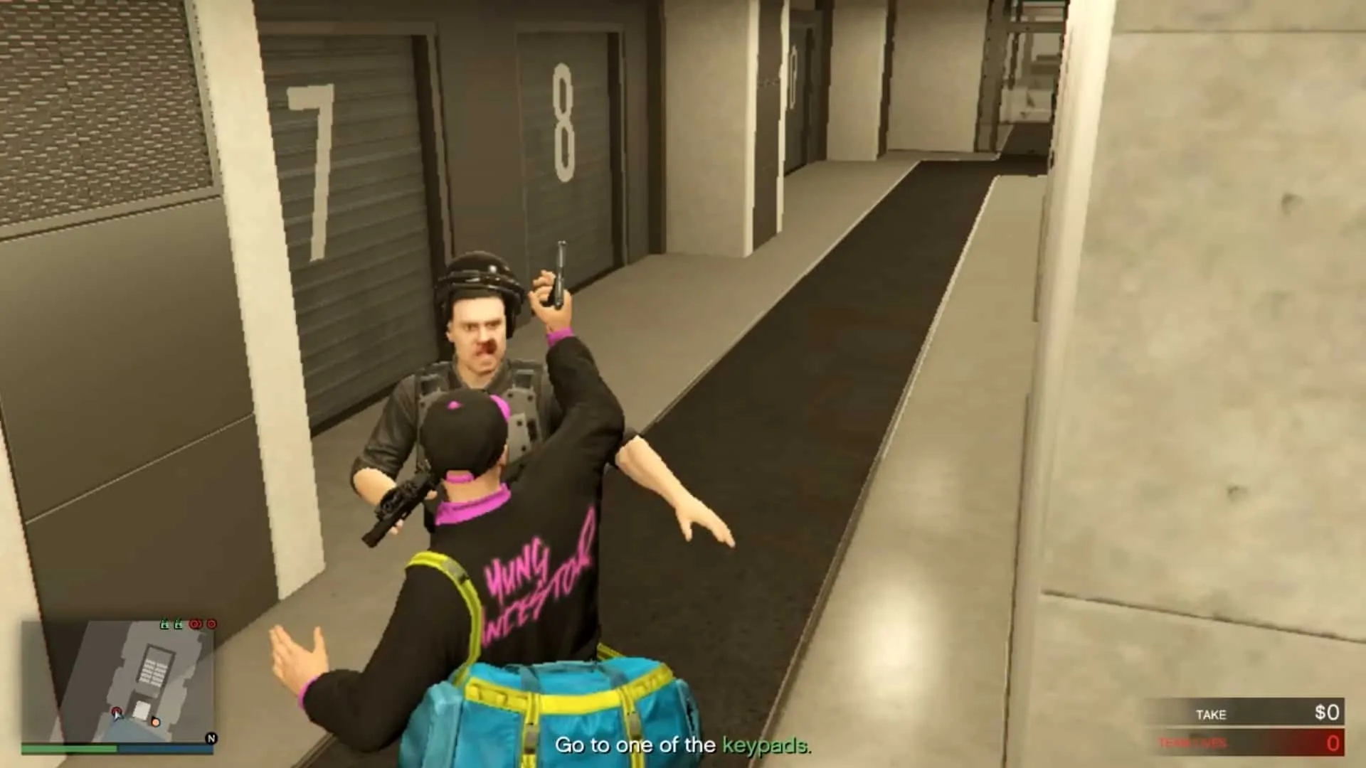 Player taking out the guard on the left hand side of the elevator with a pistol whip