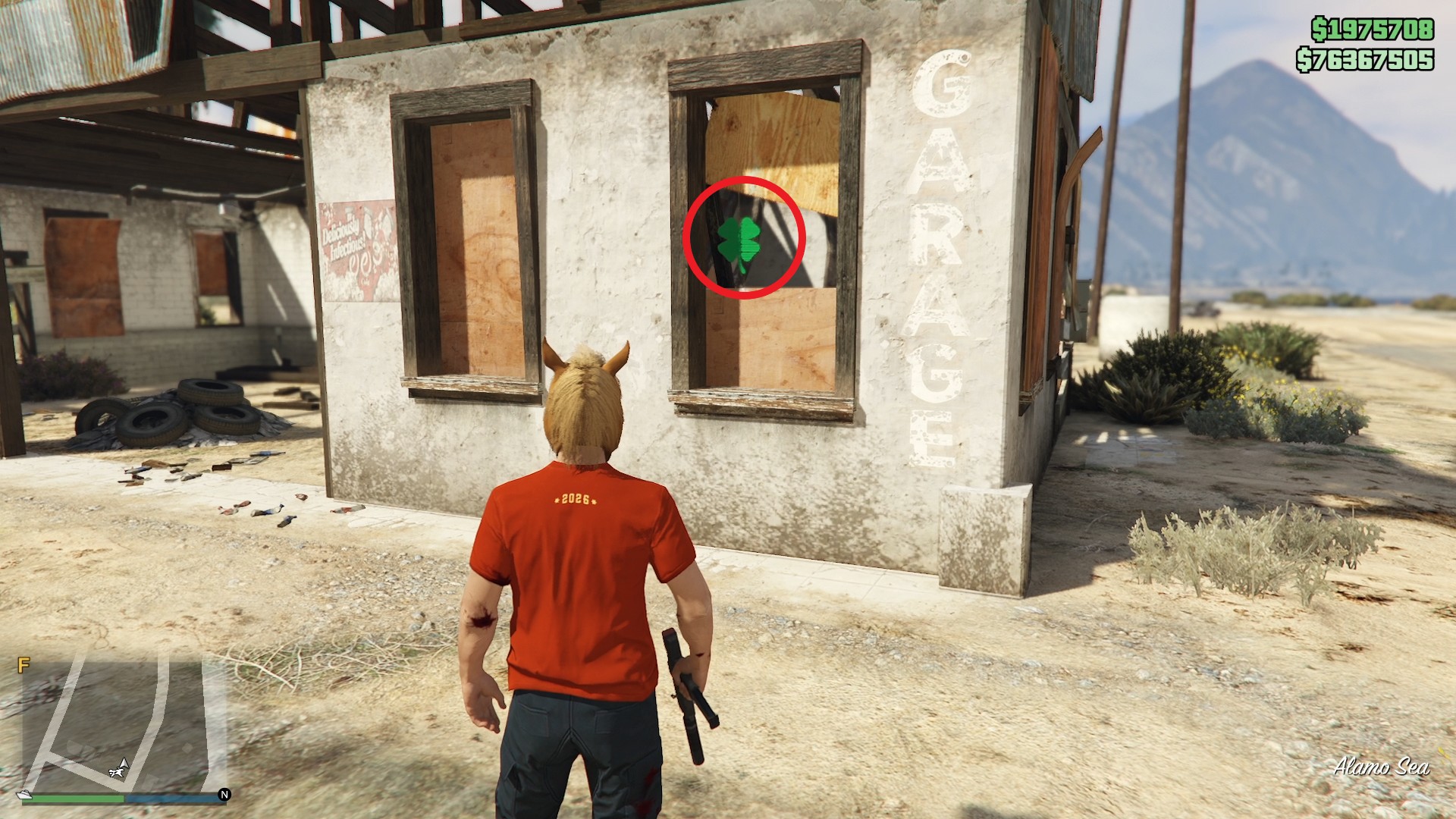 The lucky clover is inside a derelict garage window near the Alamo Sea.