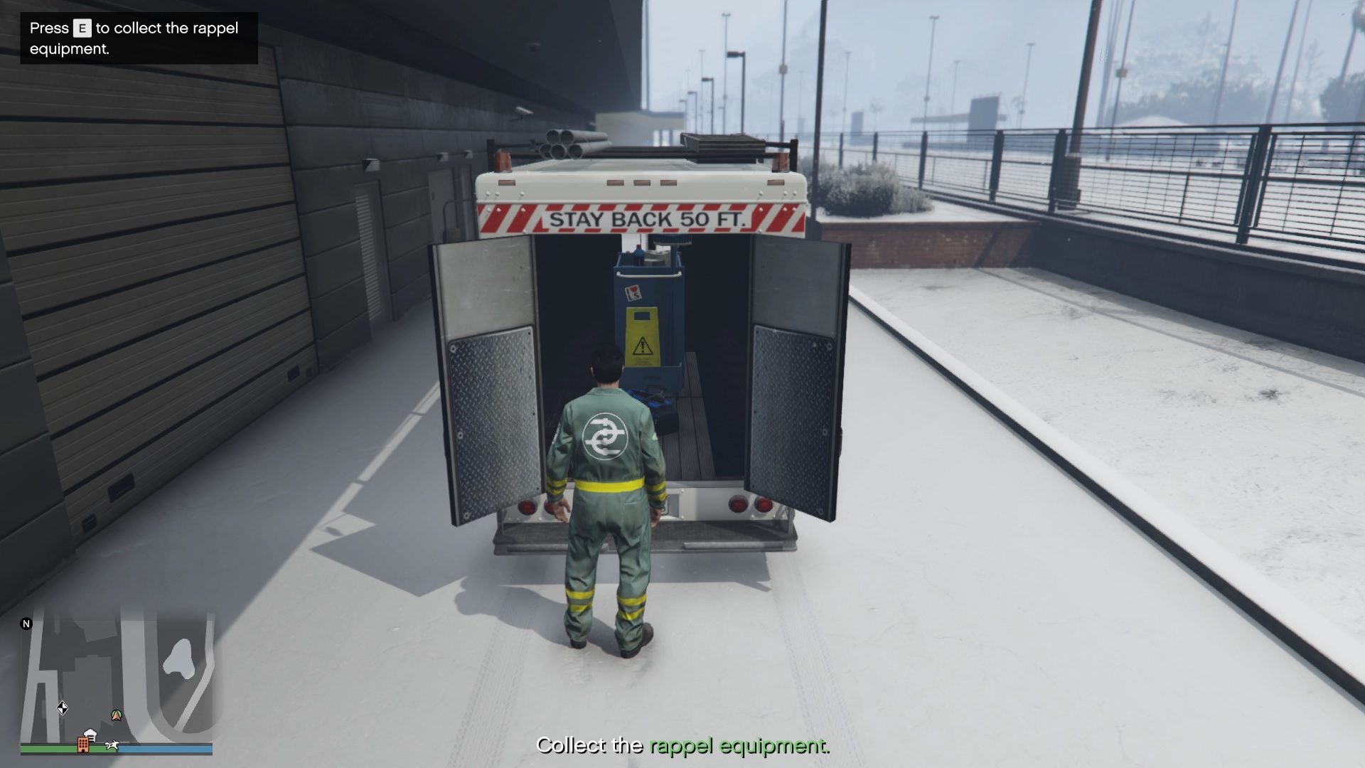 Collecting the rappel equipment from the back of the LSDS van.