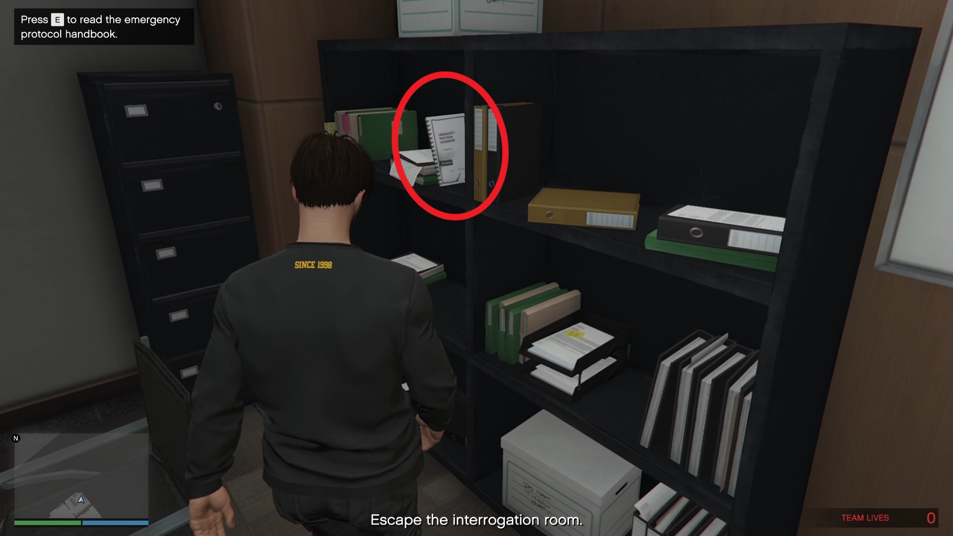 The emergency door release manual on the shelf.