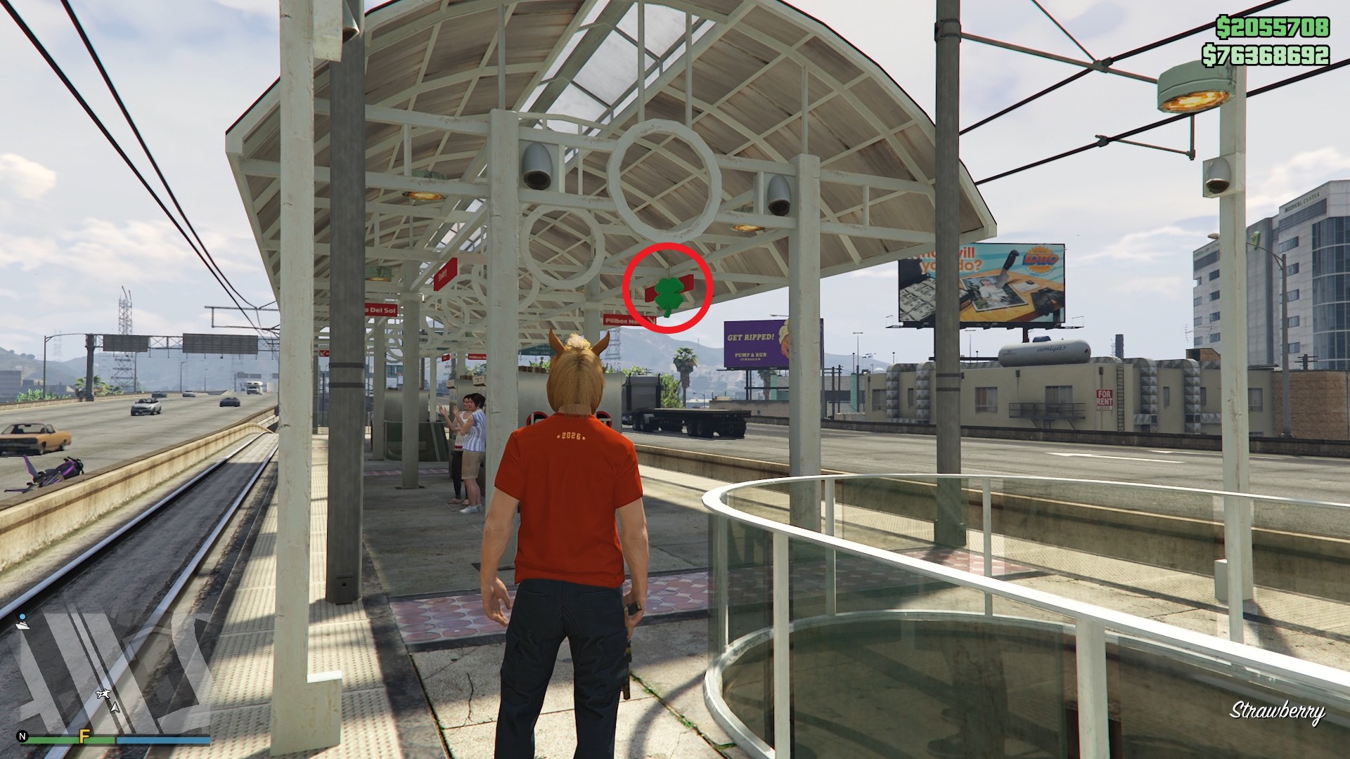 The lucky clover is hanging under the roof of the metro station platform in Strawberry.