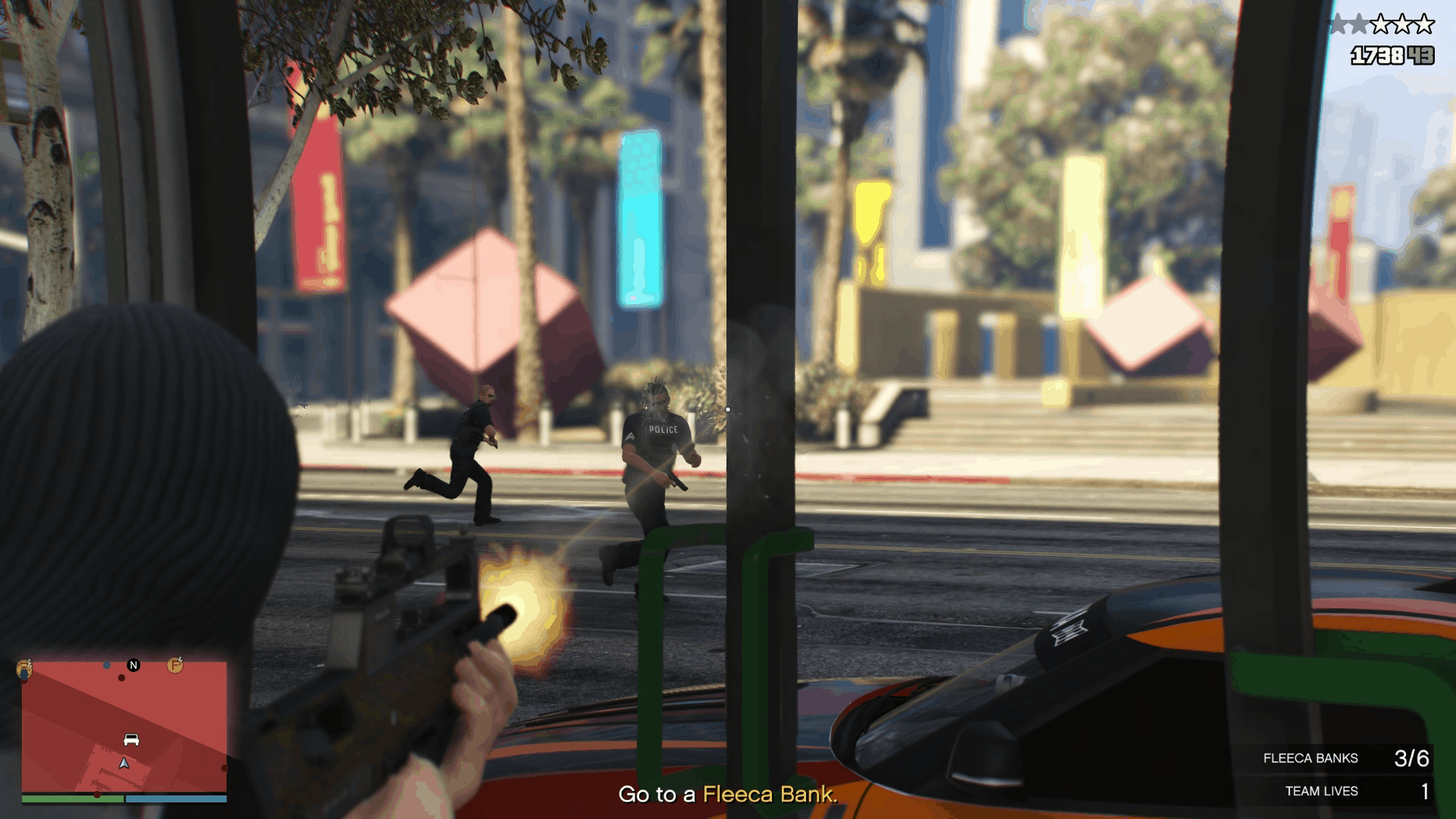 Using the bank door as cover while shooting back at the cops