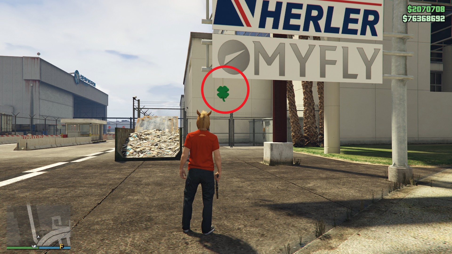 The lucky clover is hanging just below the MyFly sign outside the entrance of LSIA.