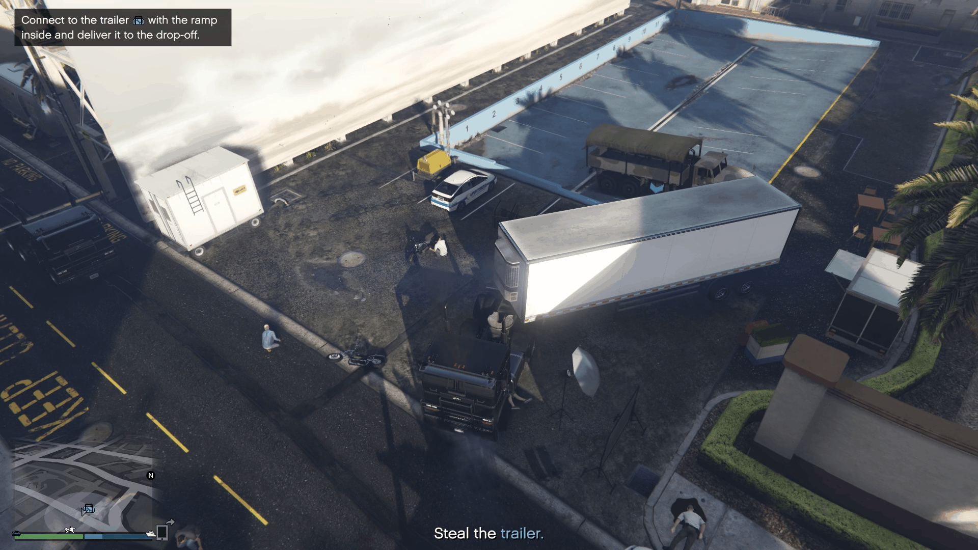 Attaching the truck to the trailer containing the ramp inside