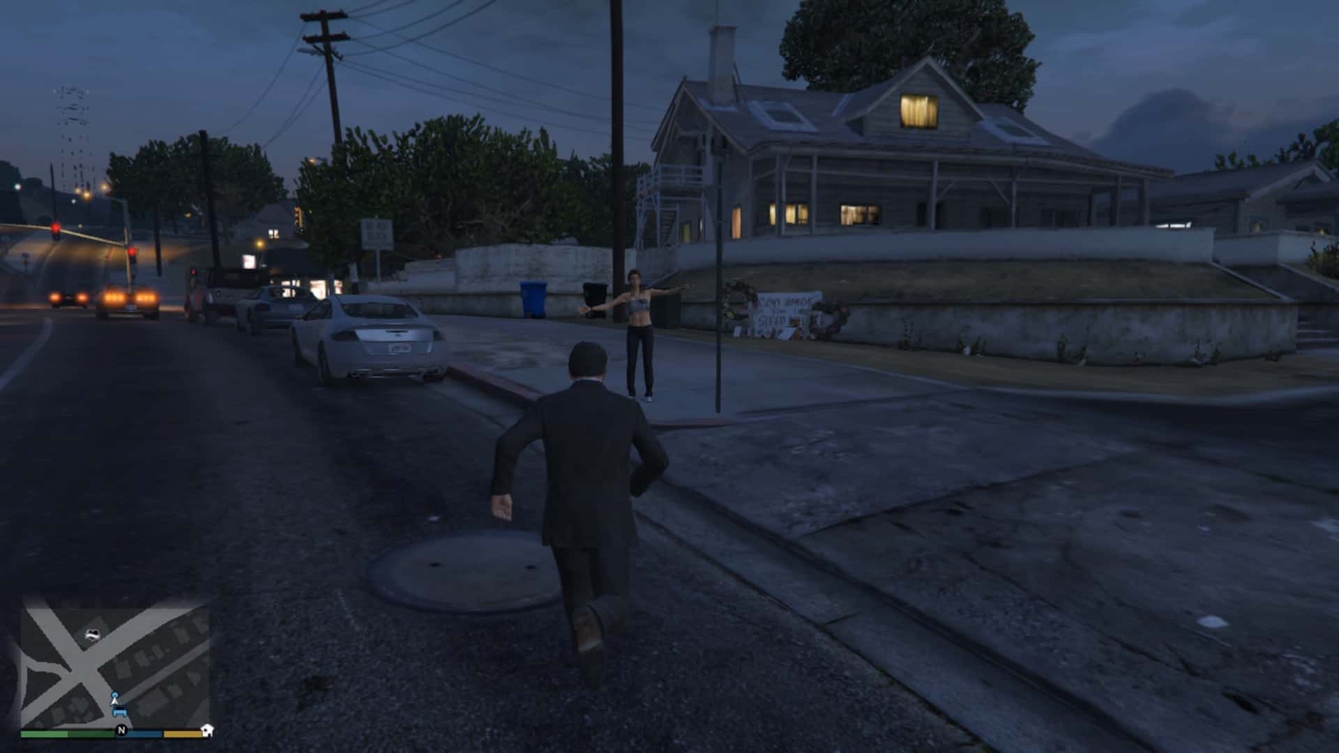 Woman on the sidewalk waving her hand calling for help