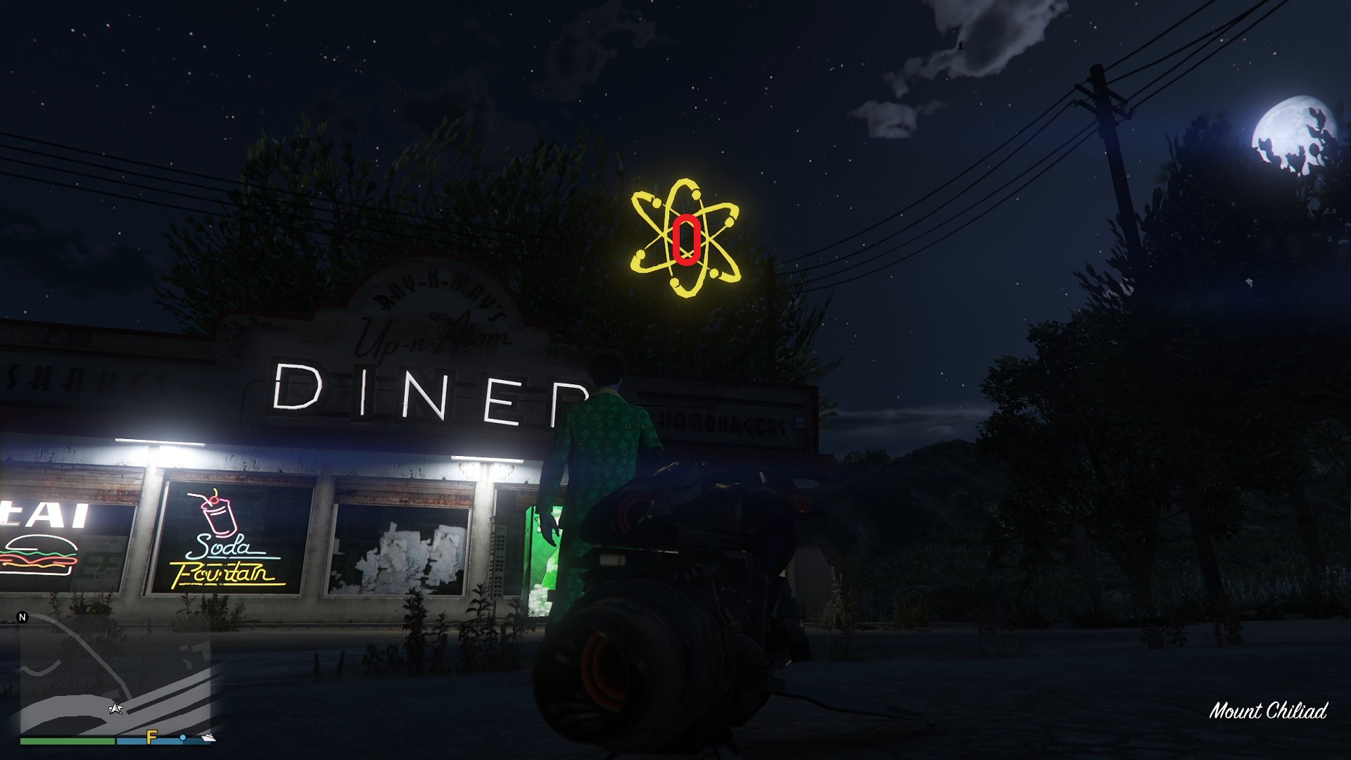 The golden clover will be hanging in the center of the atom neon sign above the Up-N-Atom Burger diner at the Procopio Truck Stop in Procopio Beach, Blaine County.