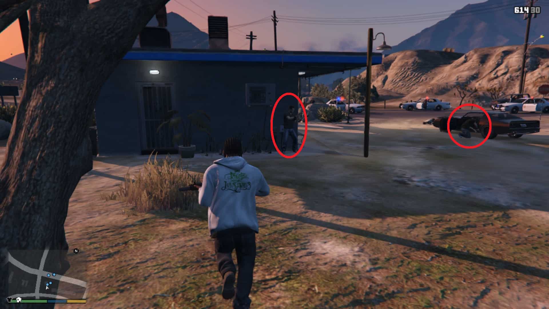 The two robbers in cover while in a gunfight with the cop