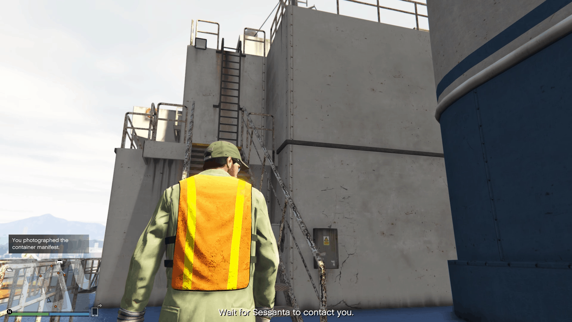 Set of stairs and ladders leading to the stack of green crates