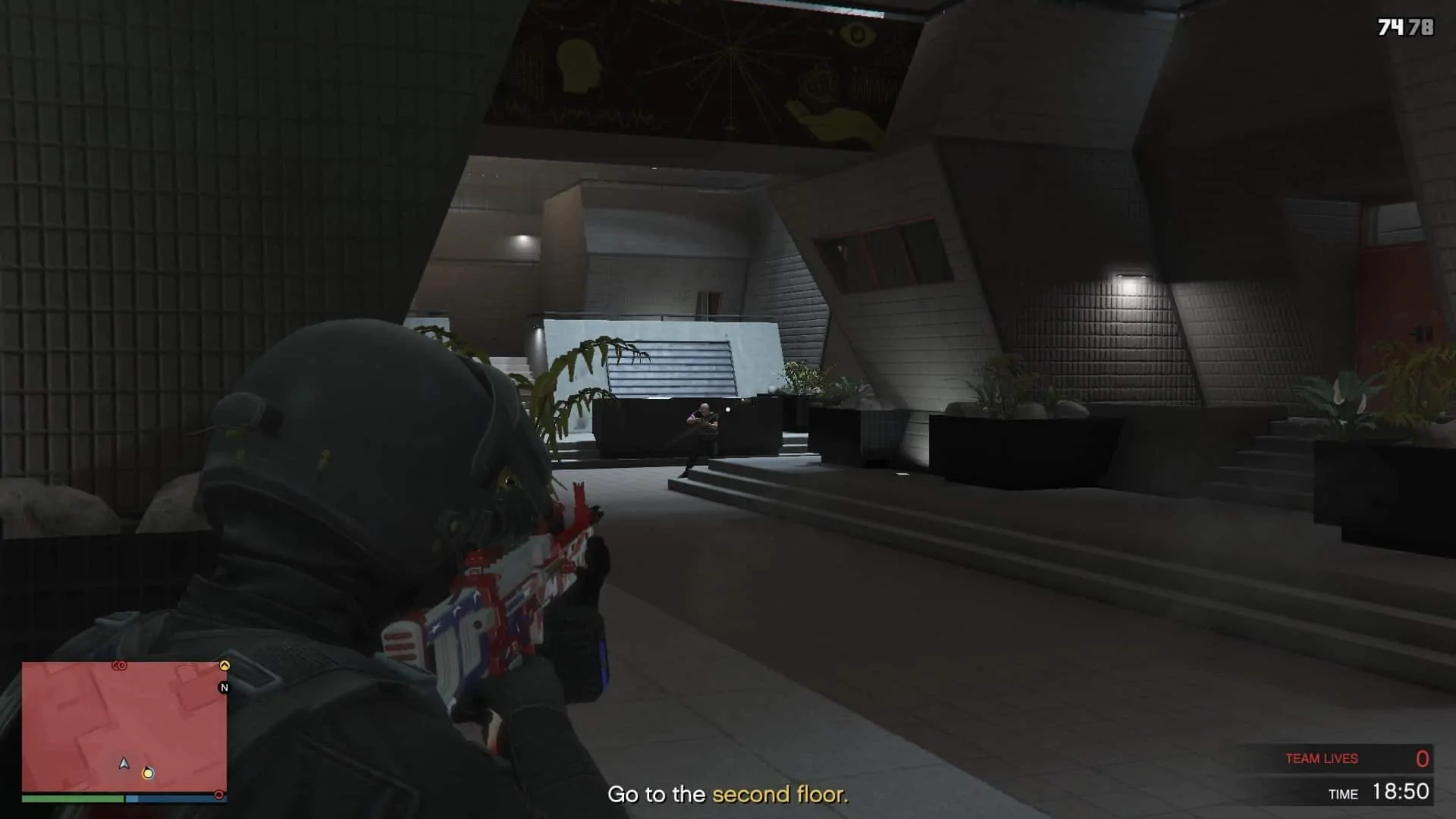 One of the three guys on the left side