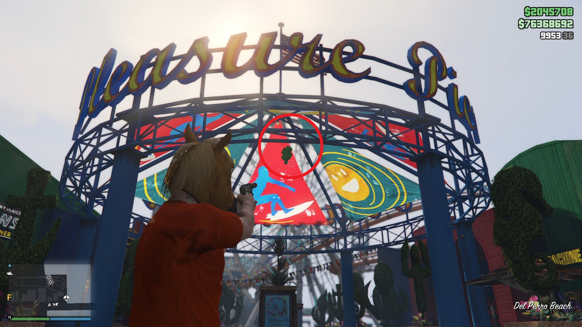 The lucky clover is hanging inside the entrance arch of the Pleasure Pier amusement park at Del Perro Beach.