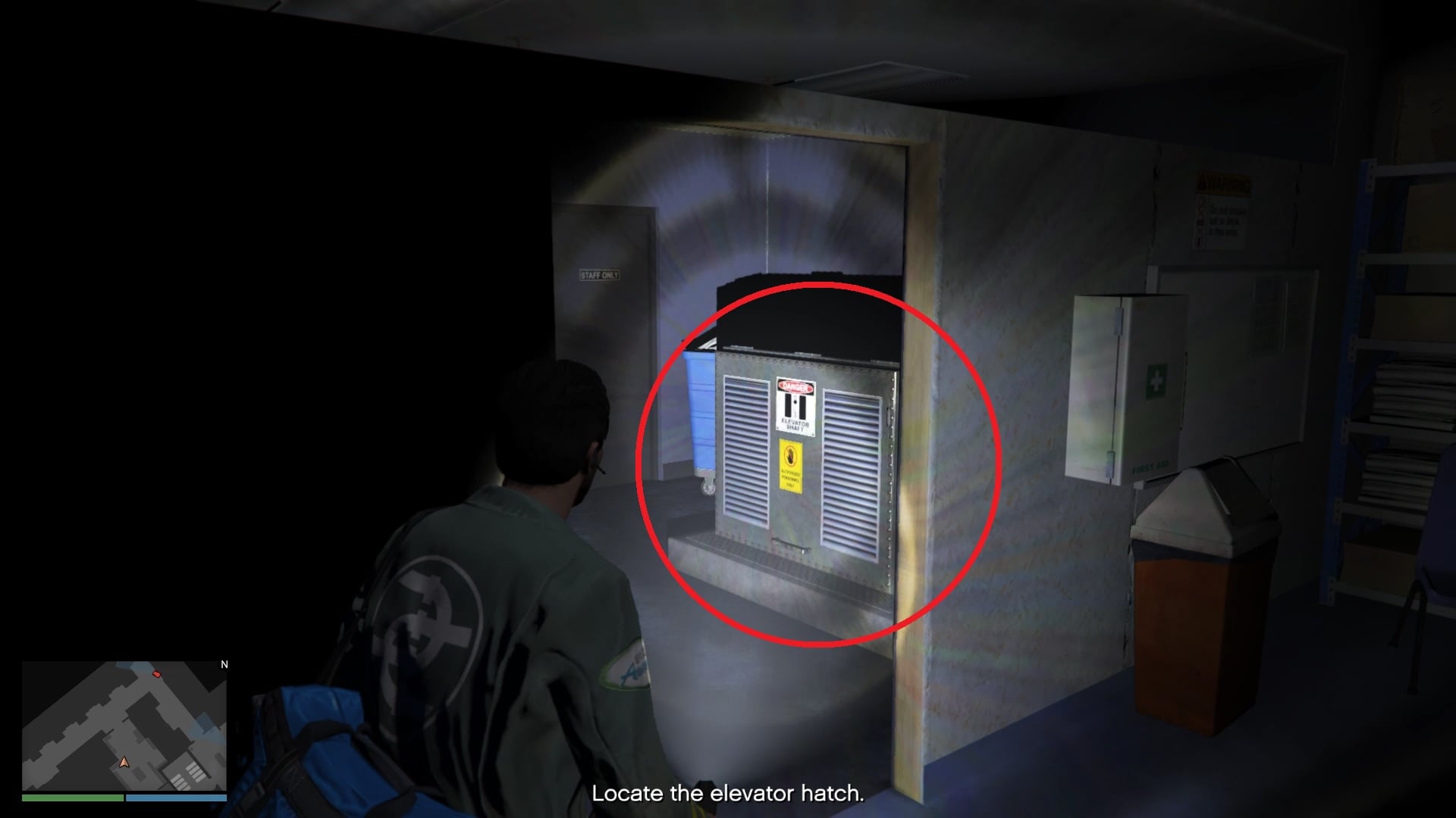 Go through the doorway to find the elevator hatch.