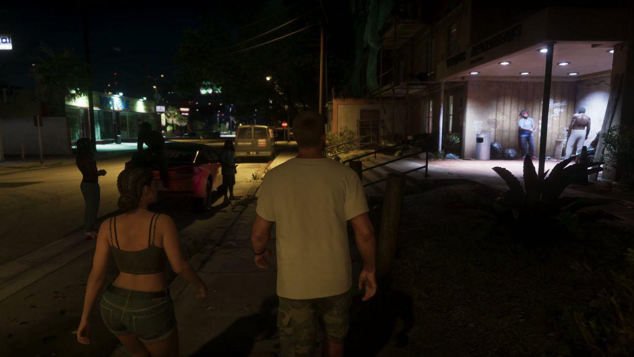Jason and Lucia approach an apartment building at night.