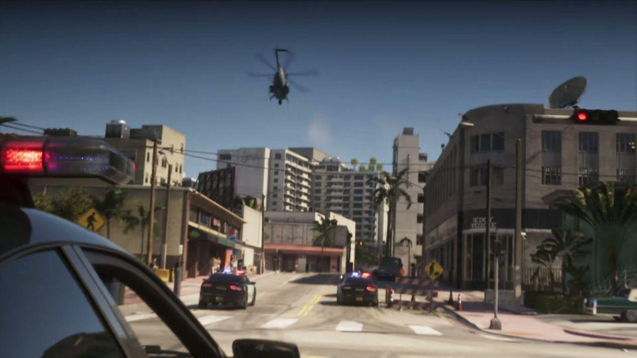 Police close the road as the pursuit races through Vice City.