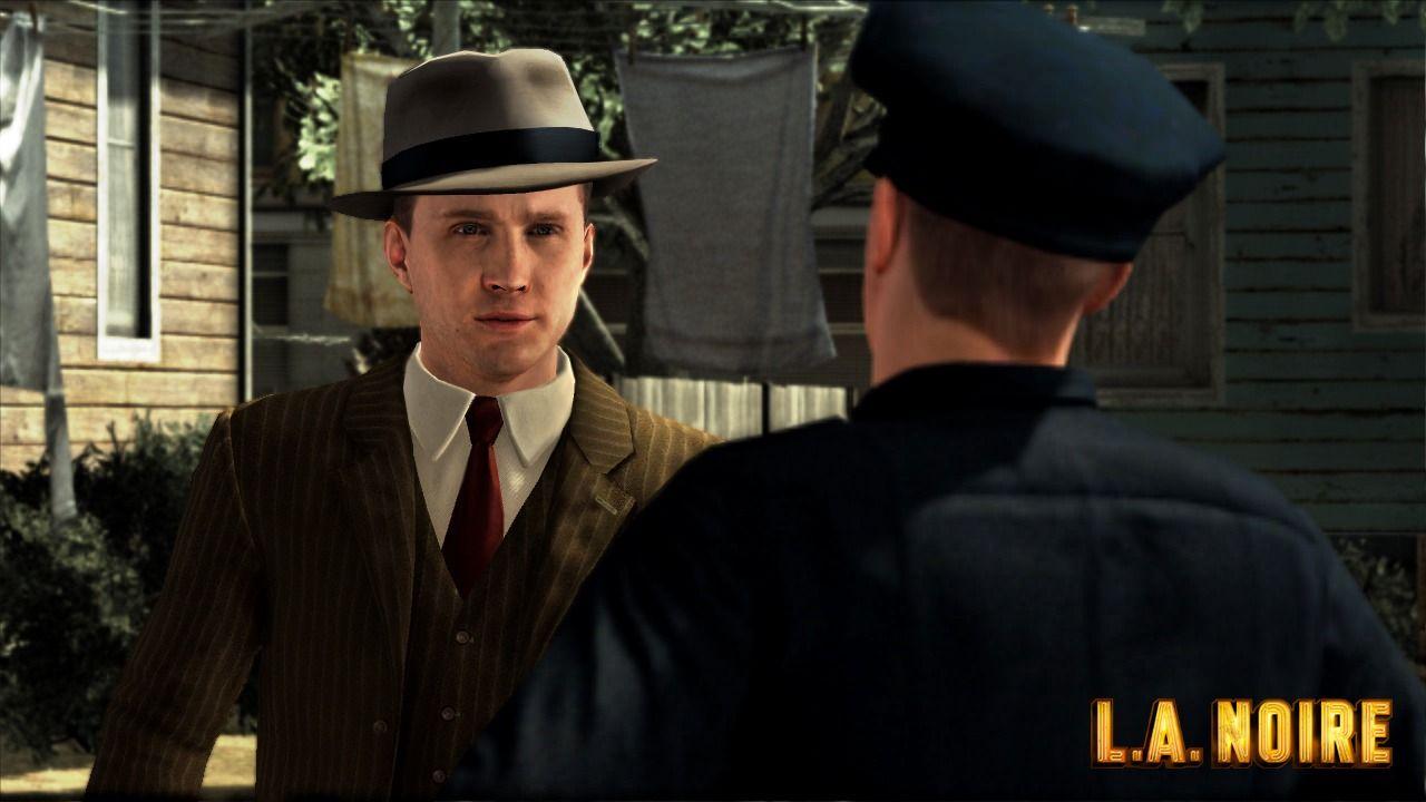 Official L.A. Noire screenshot showing Cole Phelps talking to a police officer.