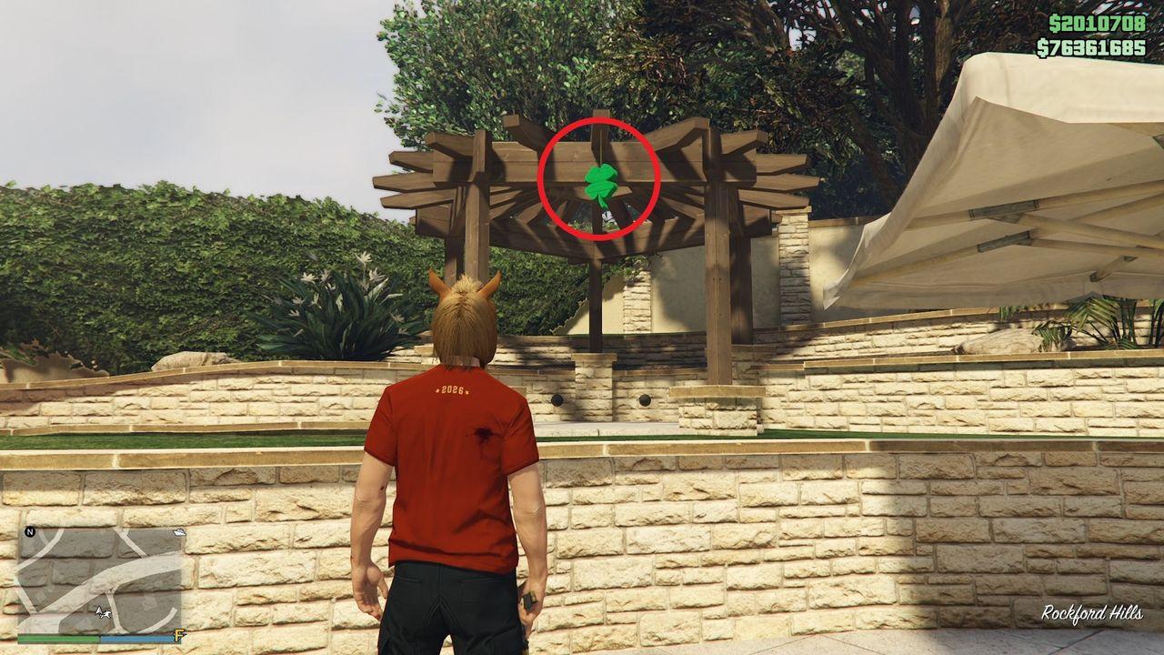 The lucky clover is hanging under a pergola in the backyard of a house in Rockford Hills.