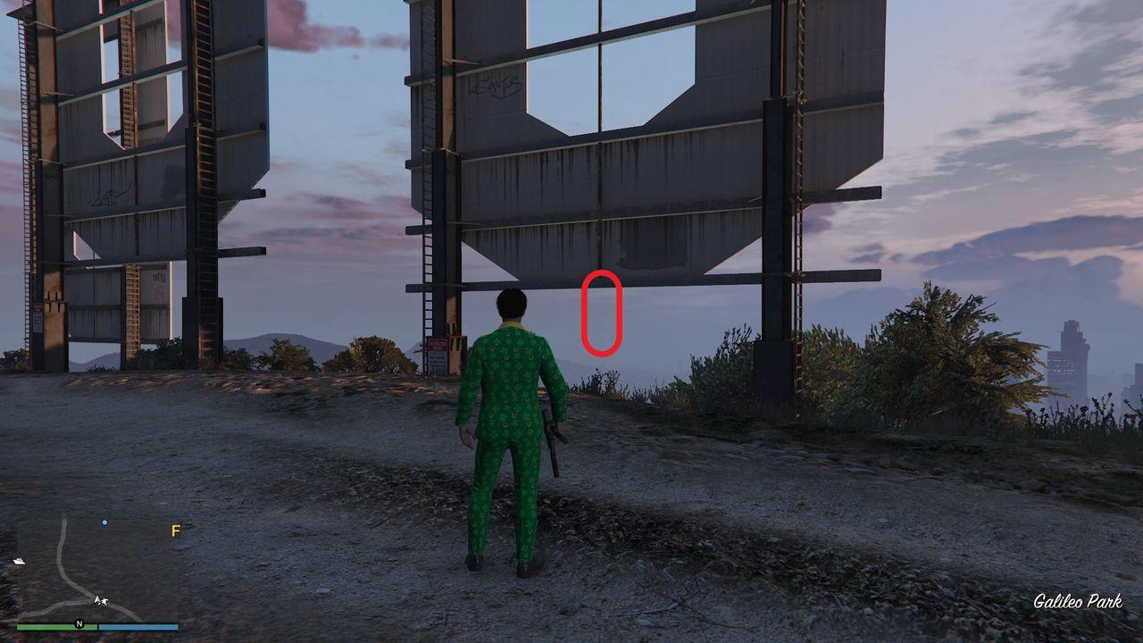 The golden clover will be hanging at the bottom of the first "O" of the Vinewood sign on Mount Haan in Vinewood Hills.
