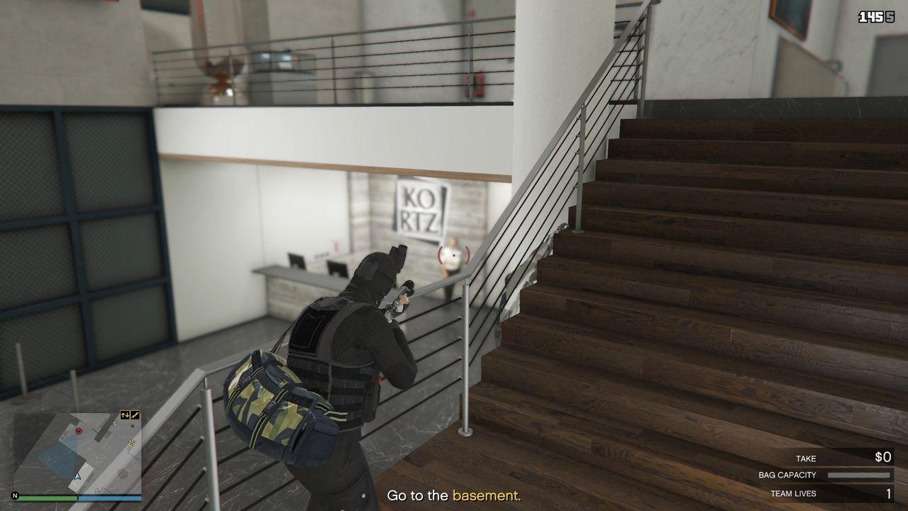 You can take out the guard behind the security desk midway through the stairs.
