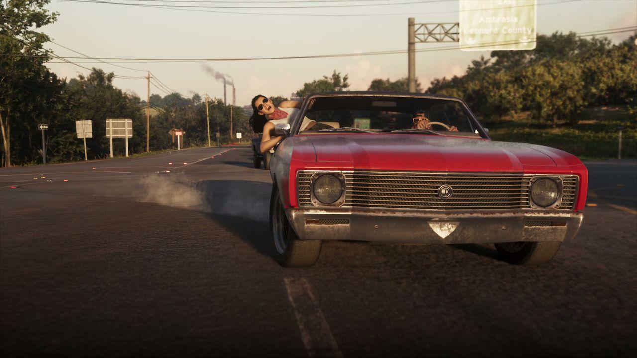 A red lowrider waits outside after the apartment escape.