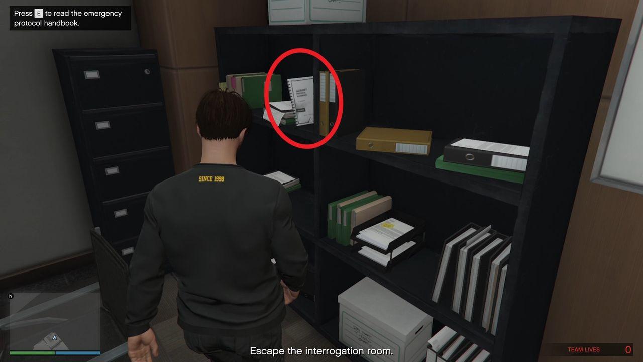 The emergency door release manual on the shelf.