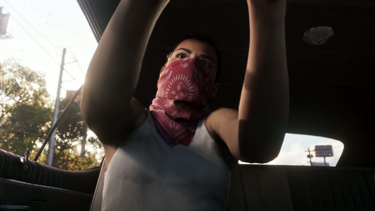 One robber climbs through a car window during the getaway.