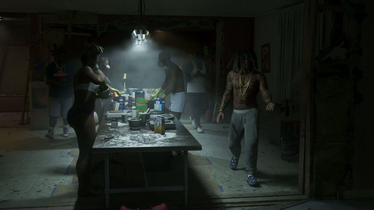 People crowd around a table inside a smoky apartment.