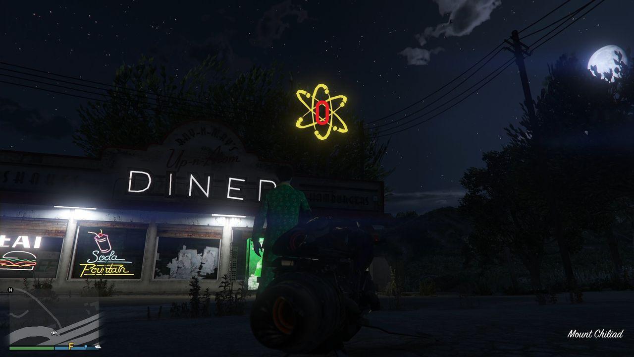 The golden clover will be hanging in the center of the atom neon sign above the Up-N-Atom Burger diner at the Procopio Truck Stop in Procopio Beach, Blaine County.