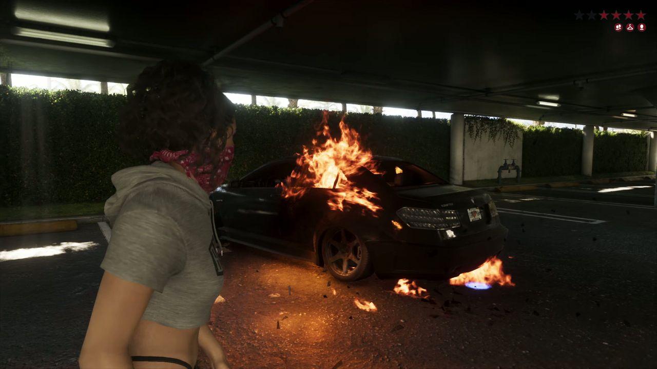 A vehicle burns inside a parking garage after the pursuit.