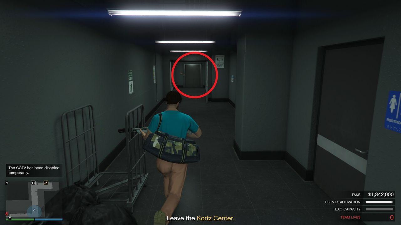 The elevator at the end of the corridor.