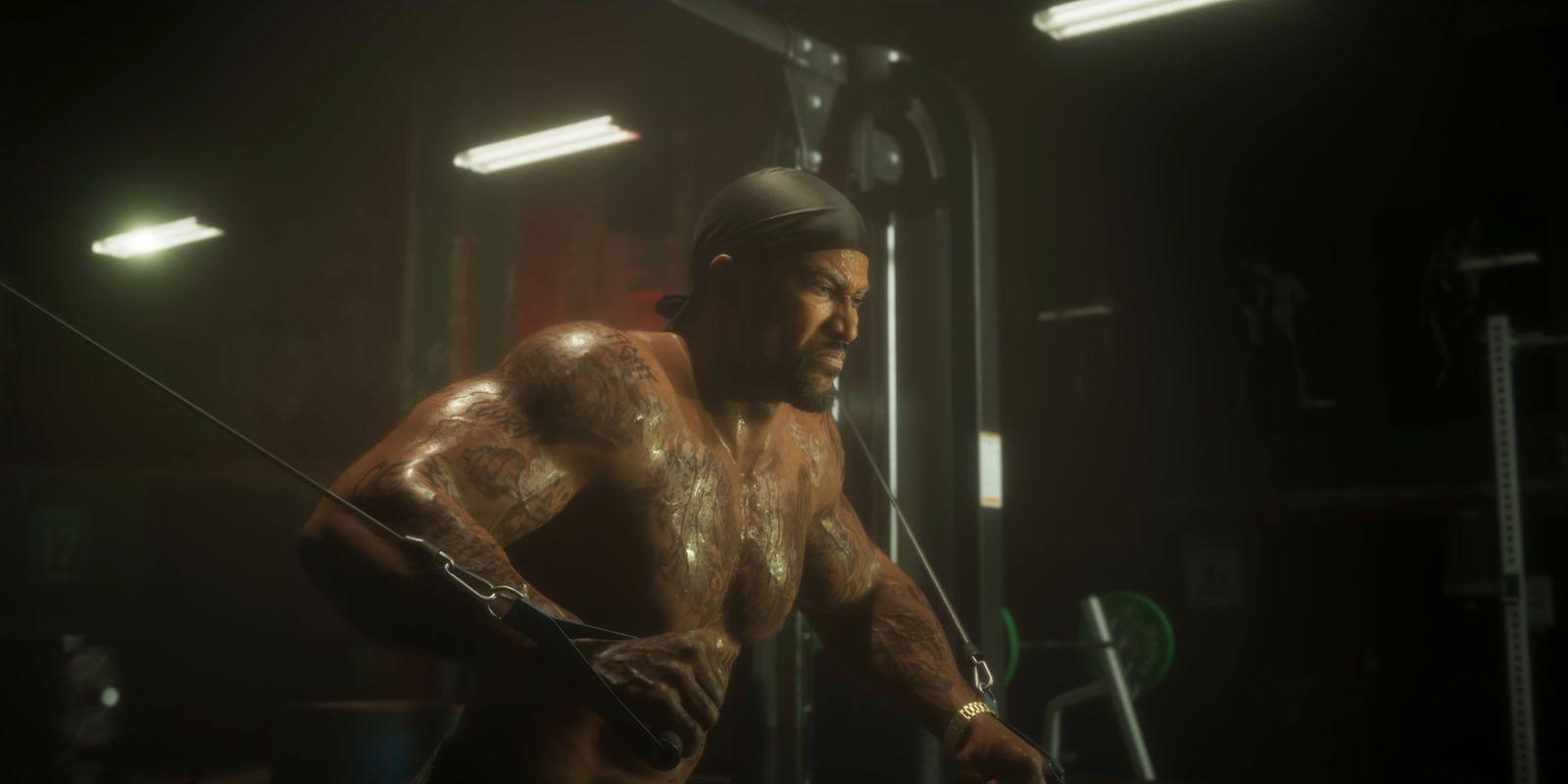 A tattooed man works out on a cable machine.