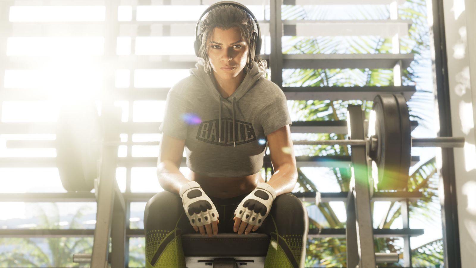 Lucia rests between rounds at a fighting gym.
