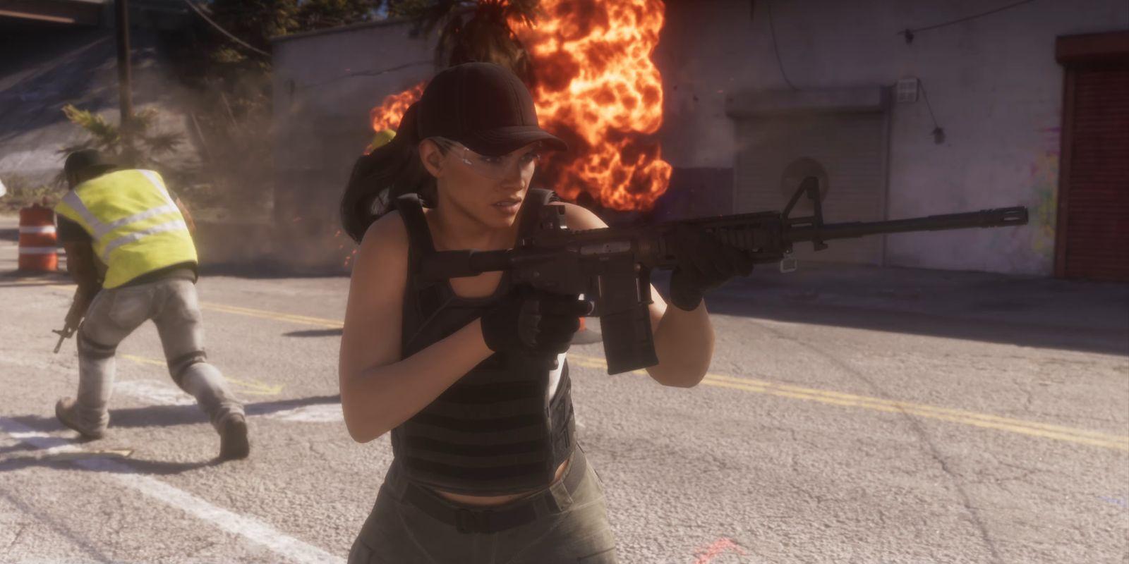 Lucia carries a rifle as flames rise behind her in the street.