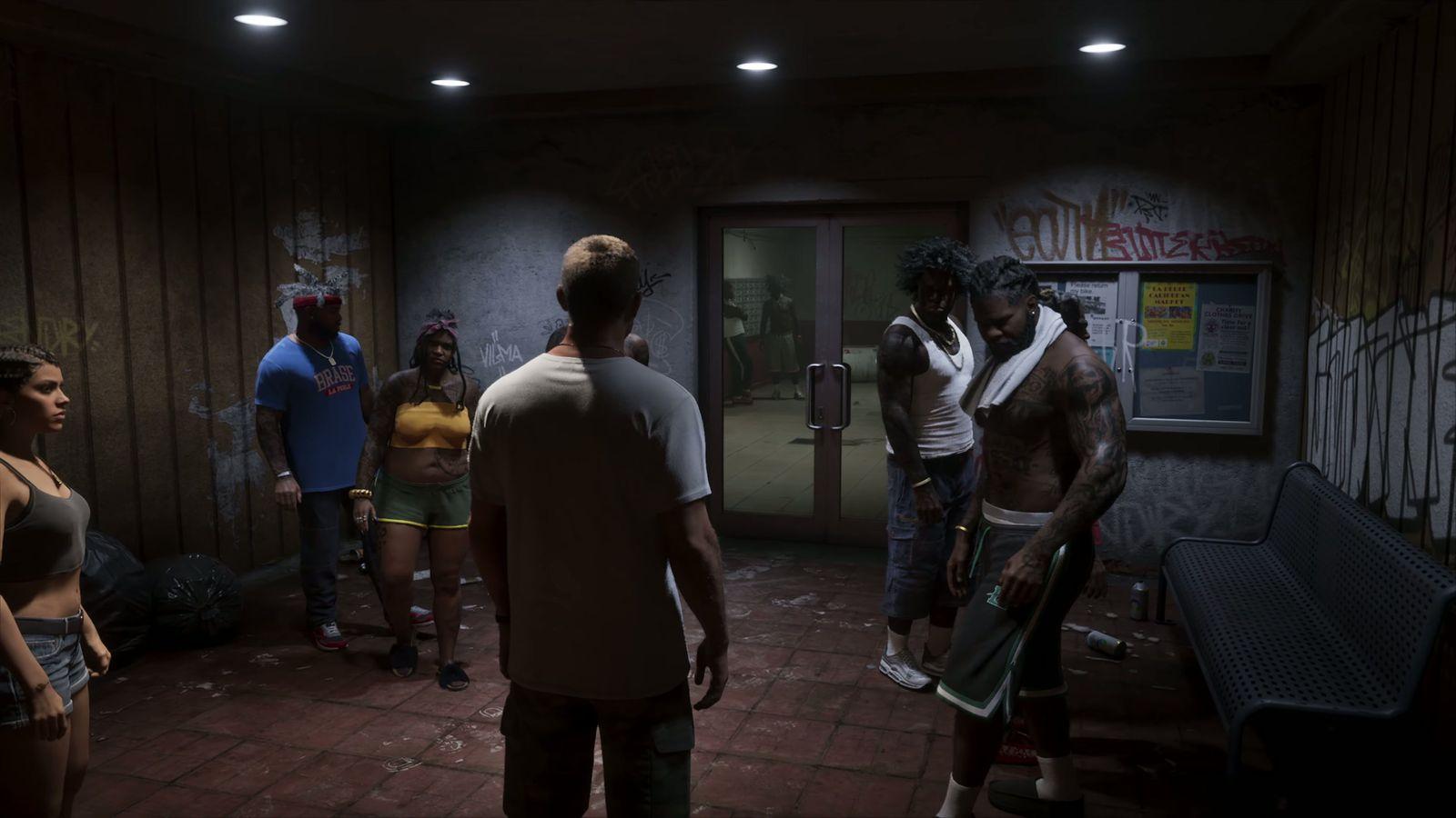 Jason and Lucia enter the lobby as a group gathers near the elevators.