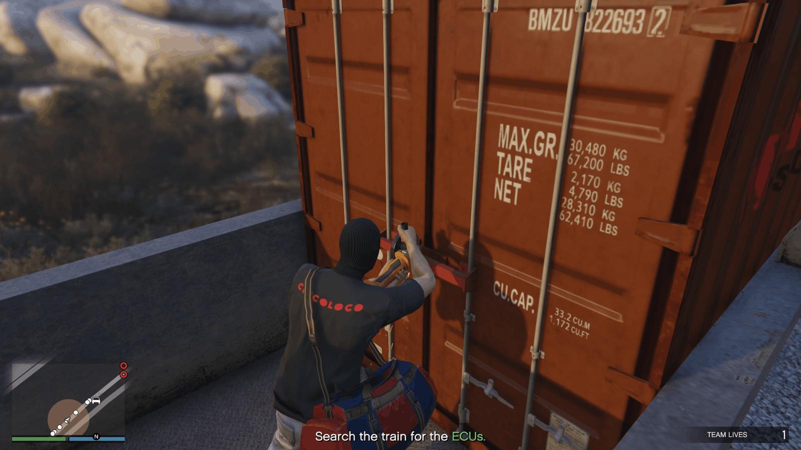 Using the industrial cutting saw to open one of the containers