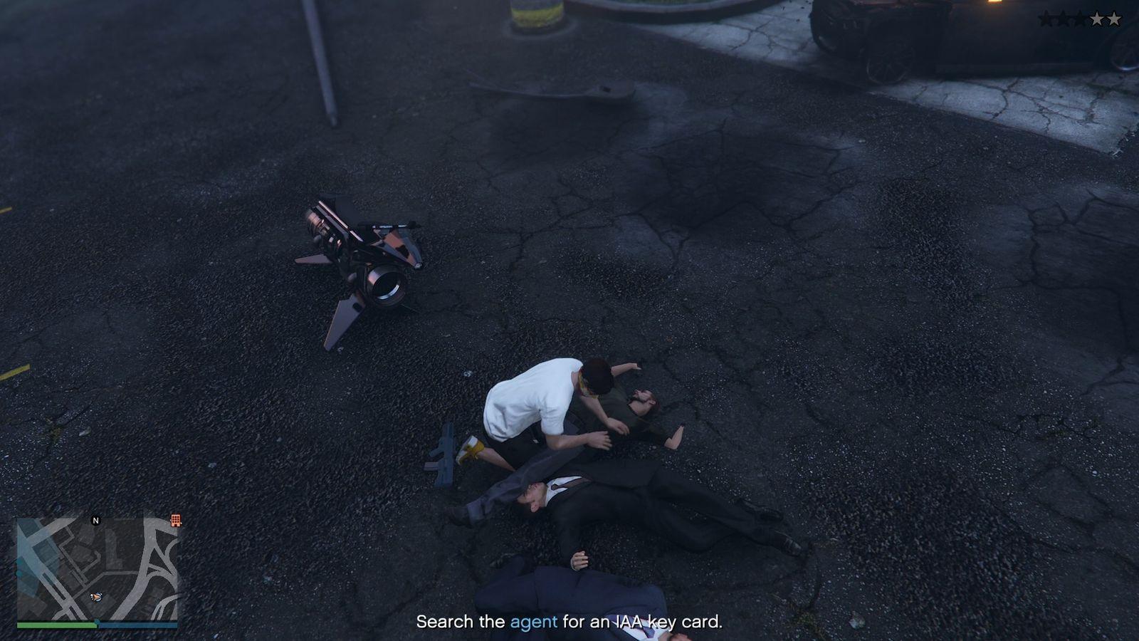 Searching the body of the corrupt IAA Agent for the IAA key card.
