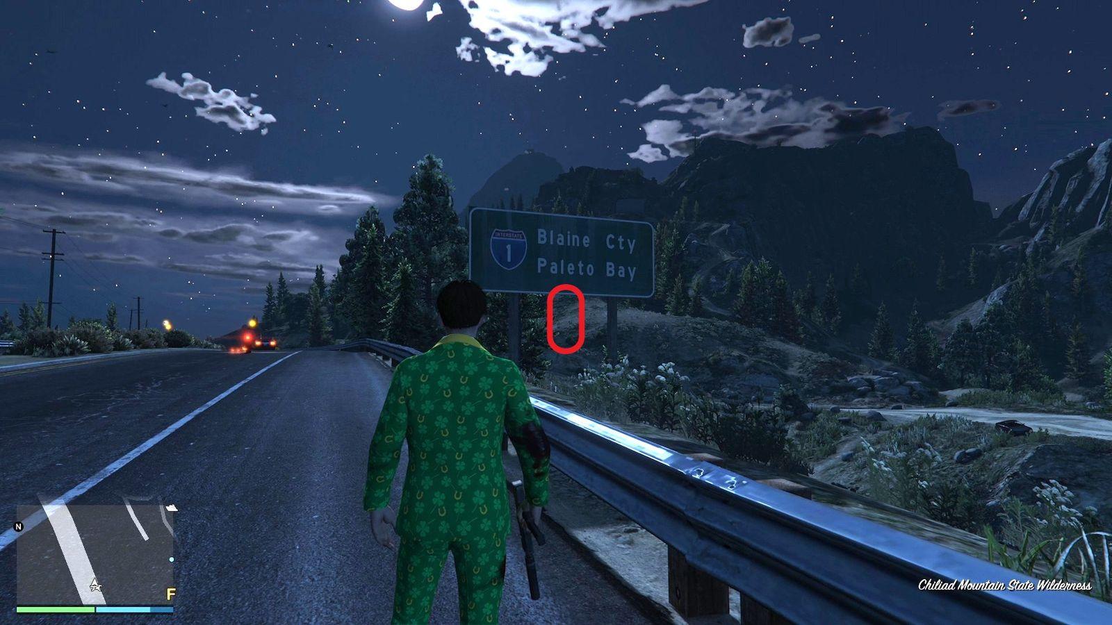 The golden clover will be hanging from the post of the Blaine County/Paleto Bay highway sign in Chiliad Mountain State Wilderness.