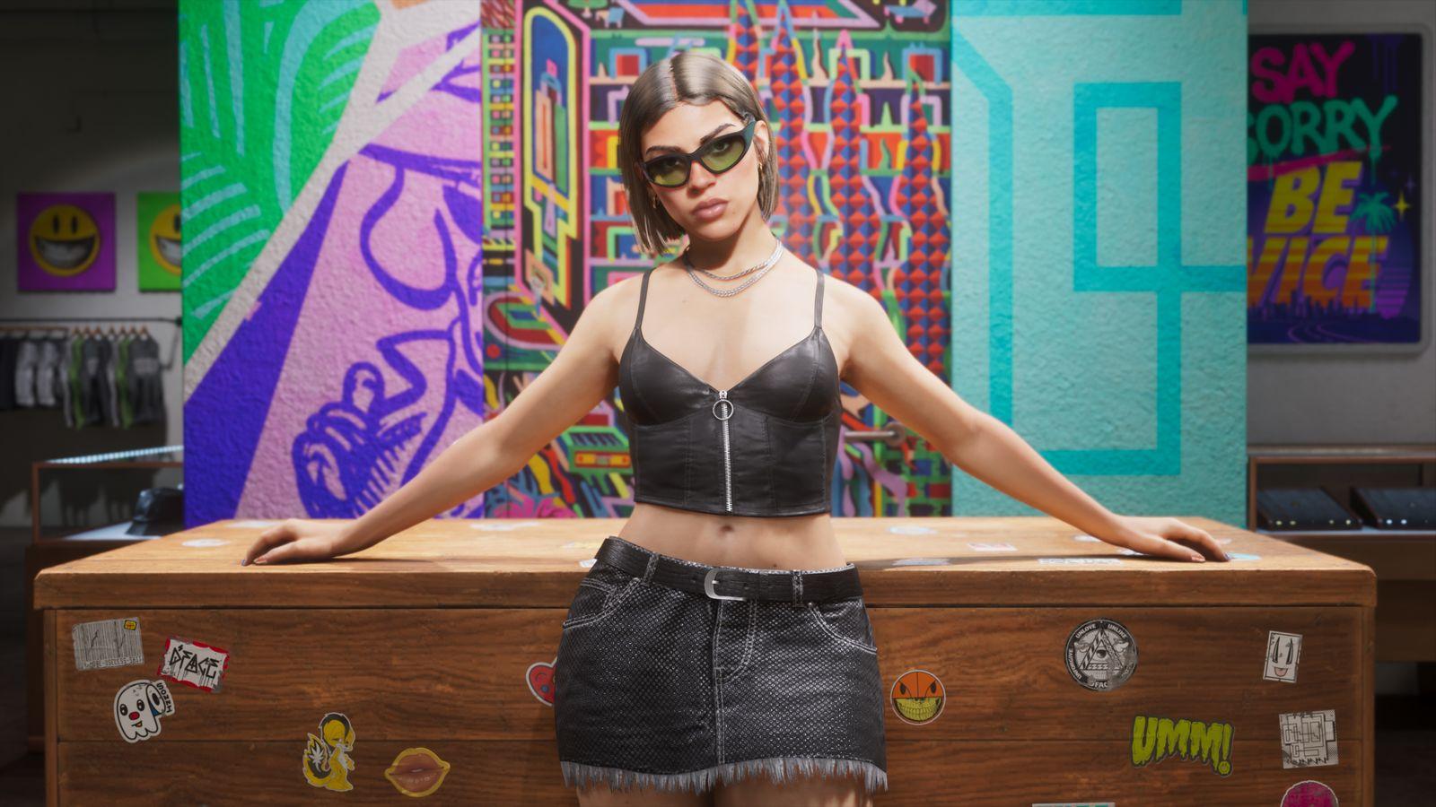 Lucia leaning against Stock 305's wooden counter with geometric murals and clothing rails behind her.