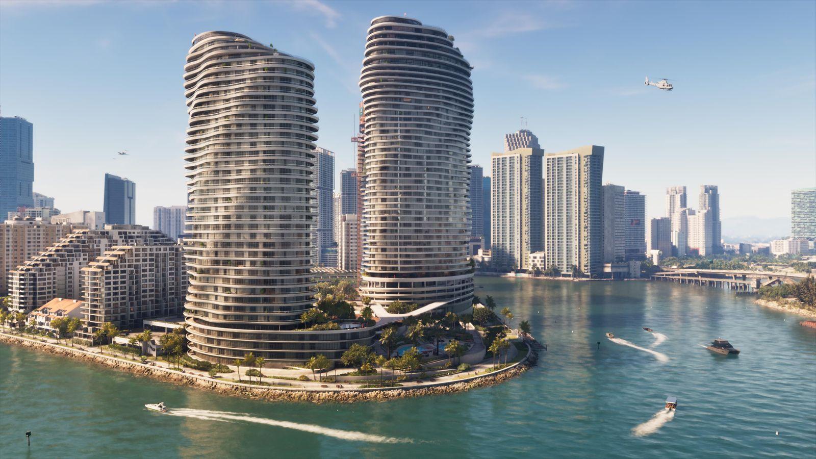Boats pass the waterfront towers of Vice City.