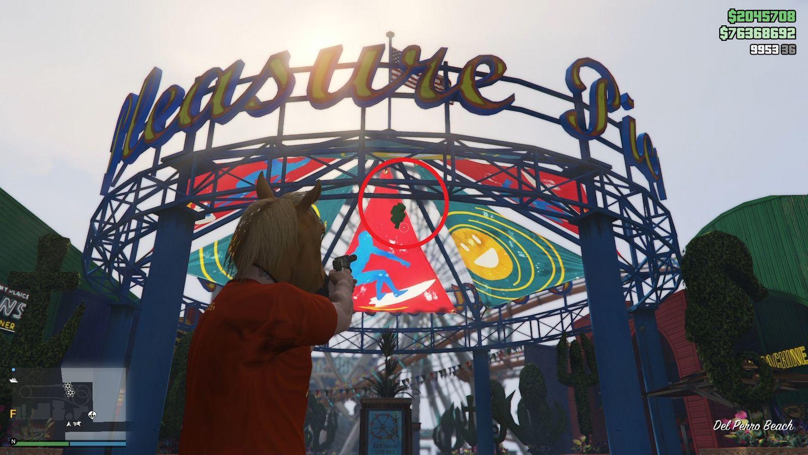 The lucky clover is hanging inside the entrance arch of the Pleasure Pier amusement park at Del Perro Beach.