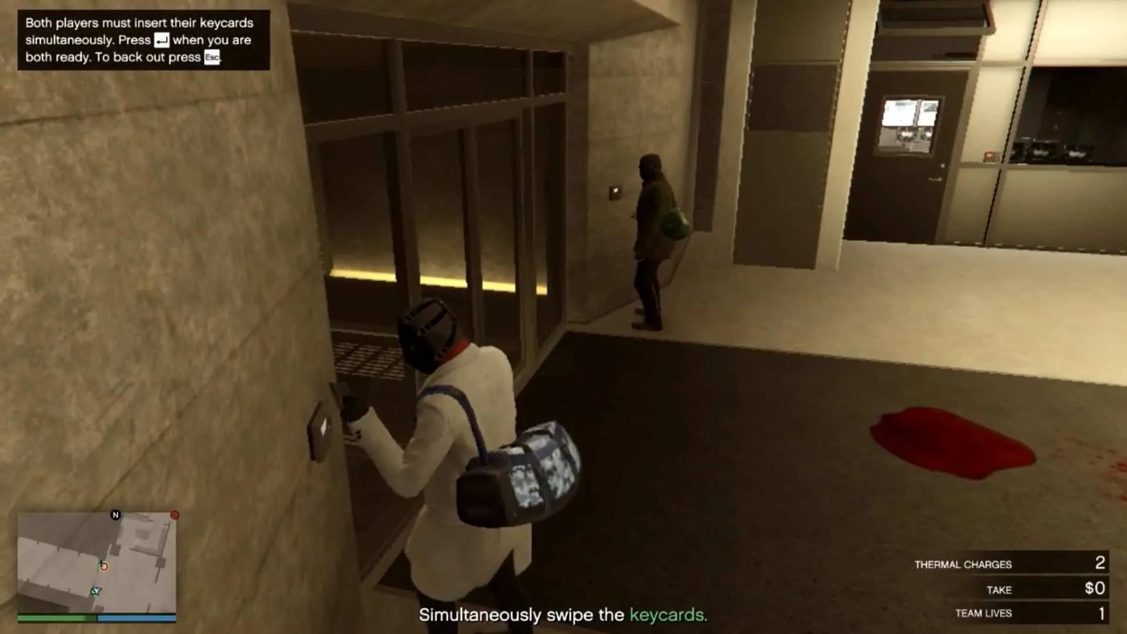 Simultaneously swiping the keycards to open the entrance to the mantrap leading to the vault
