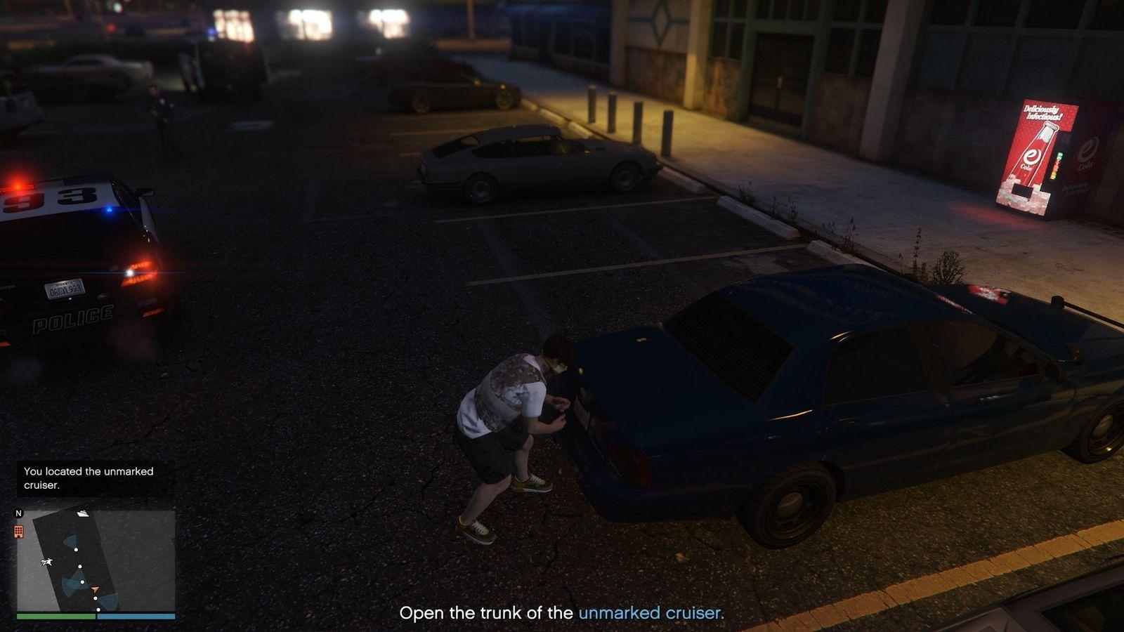 Unlocking the trunk of the unmarked cruiser with the radio trackers.