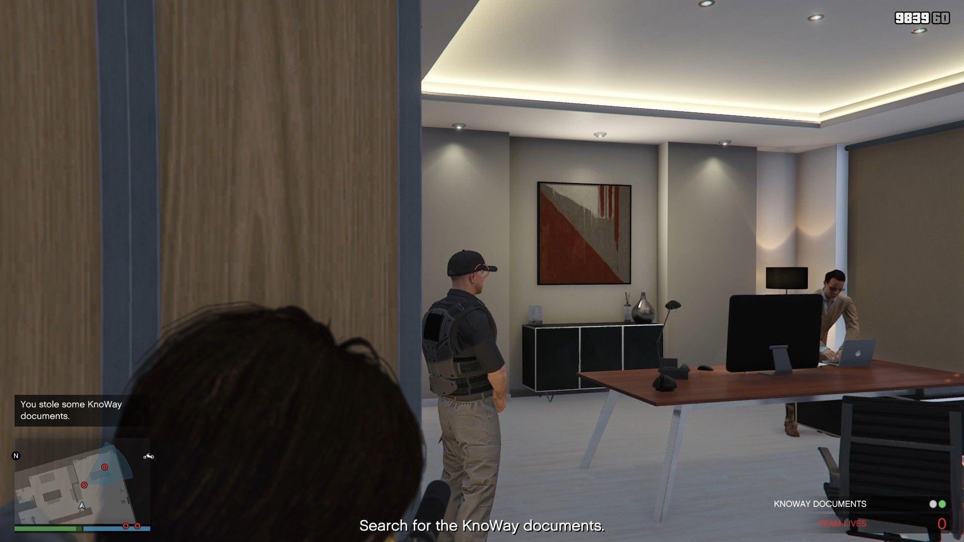 The guard and the employee, through the second server room door.