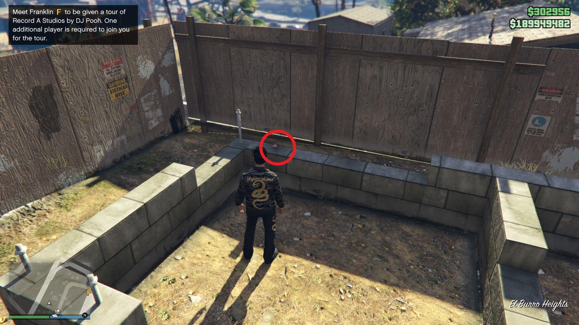 The Yuanbao is on a layer of bricks inside the plot of the unfinished house next to Lester's house at El Burro Heights.