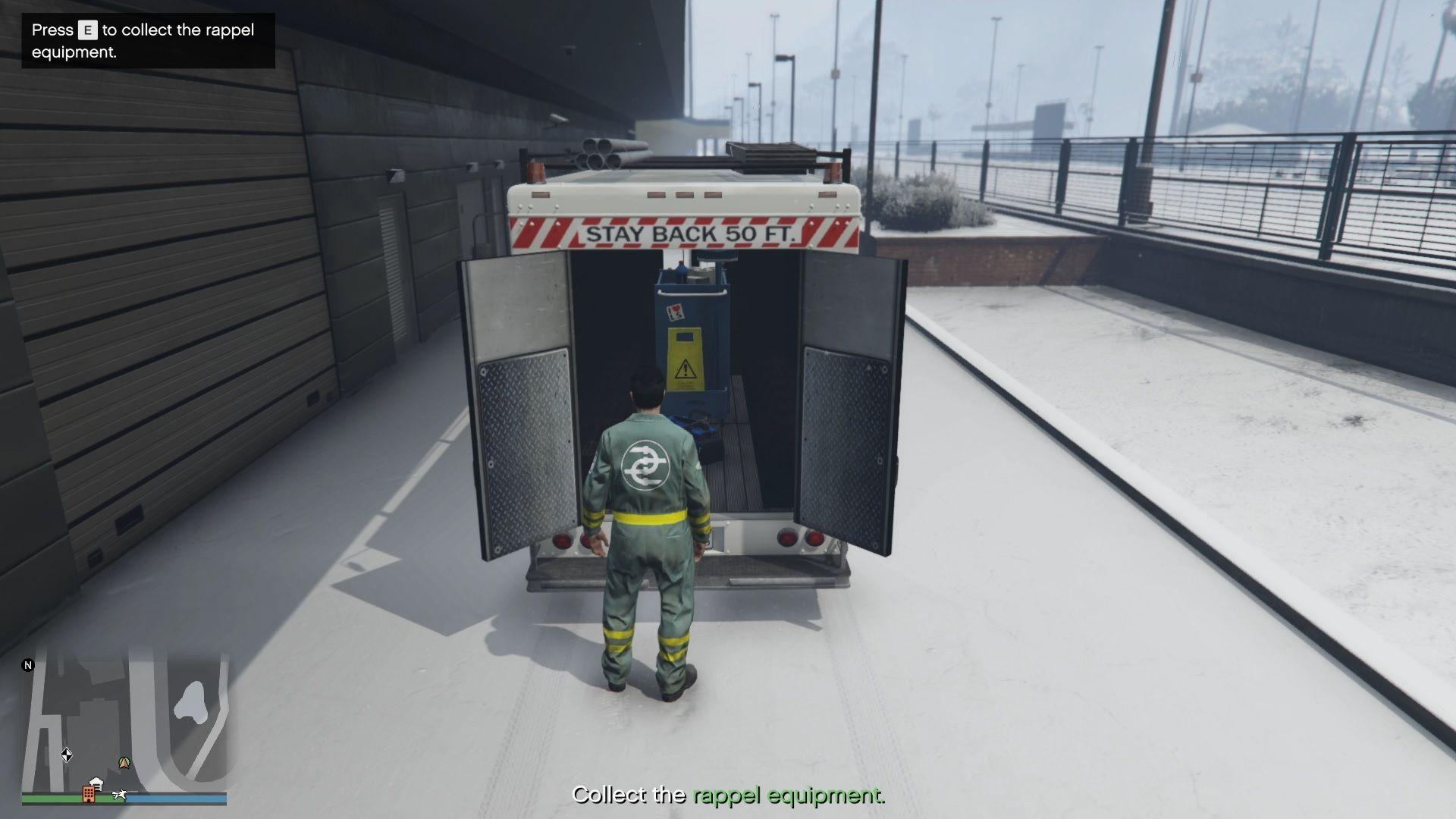 Collecting the rappel equipment from the back of the LSDS van.