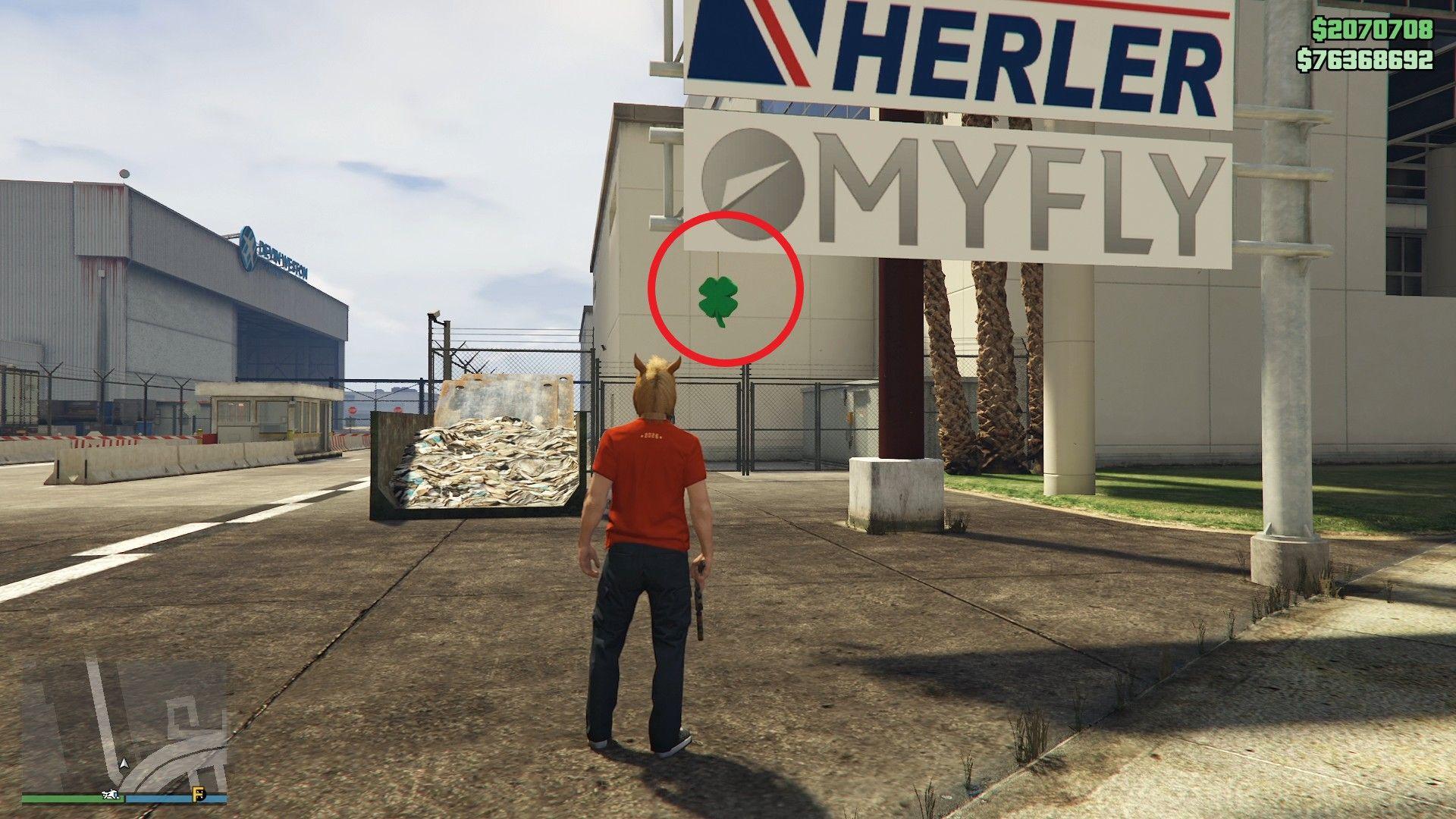 The lucky clover is hanging just below the MyFly sign outside the entrance of LSIA.