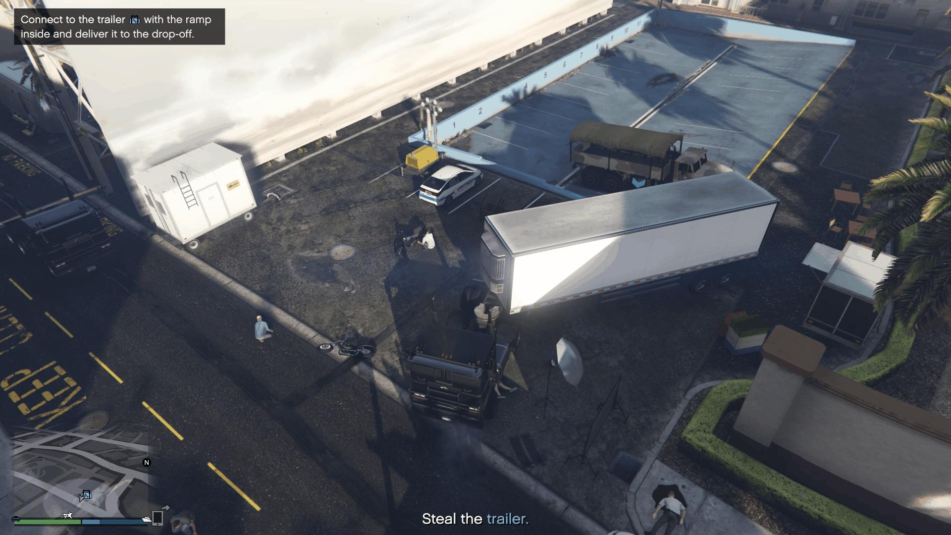 Attaching the truck to the trailer containing the ramp inside